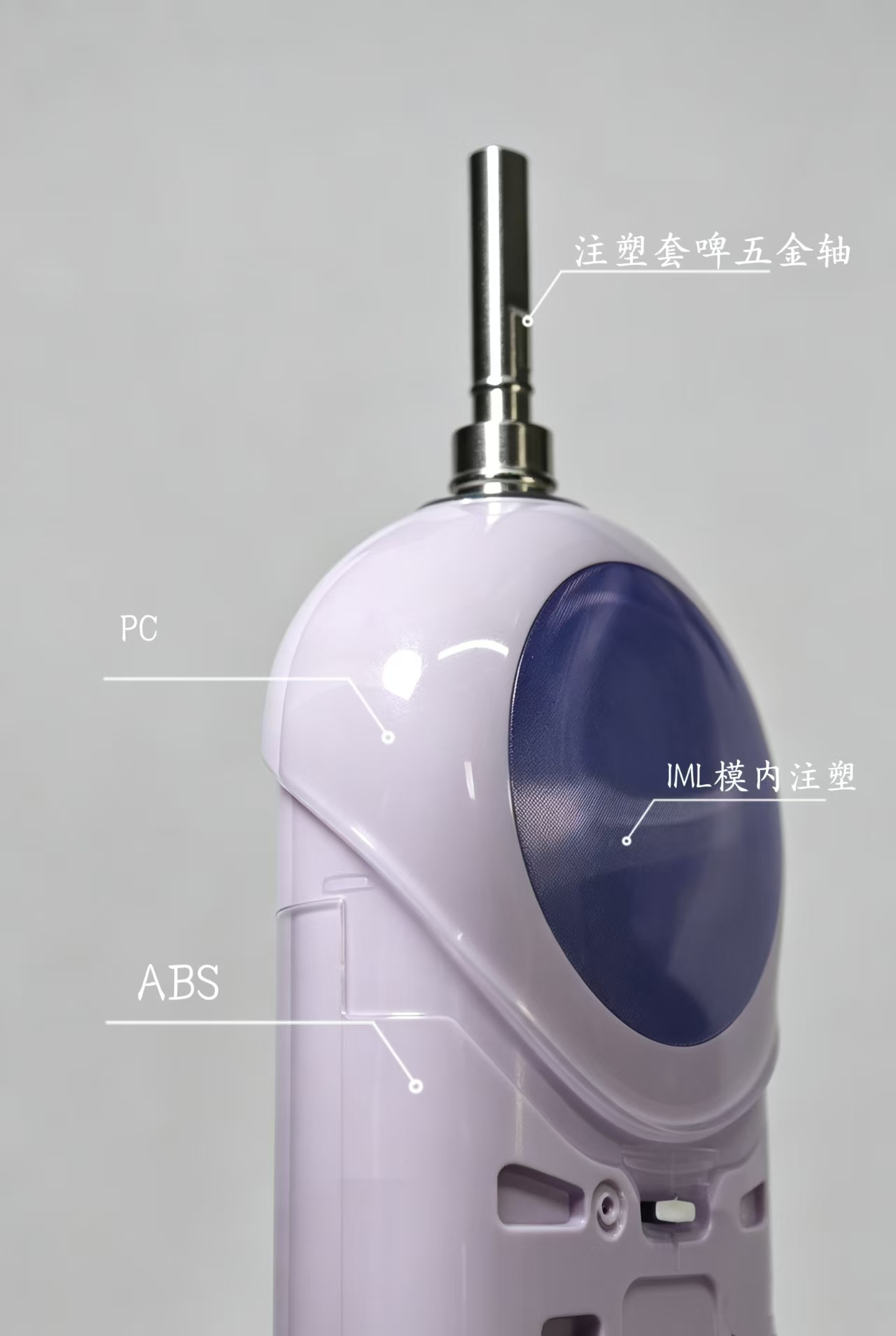 Two-shot molded electric toothbrush pivot cover